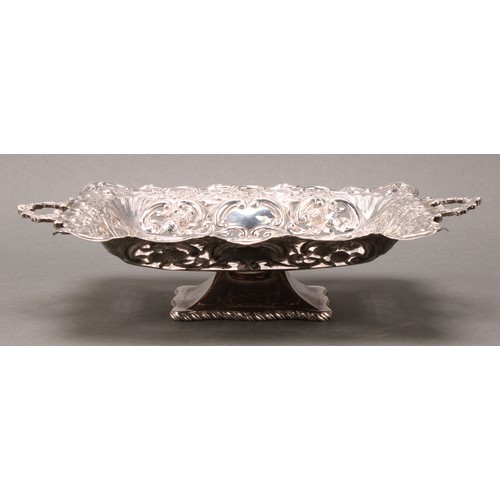 238 - An Edwardian silver rectangular pedestal fruit or sweetmeat dish, pierced and embossed with flowers ... 