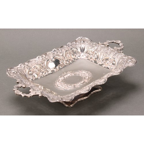 238 - An Edwardian silver rectangular pedestal fruit or sweetmeat dish, pierced and embossed with flowers ... 