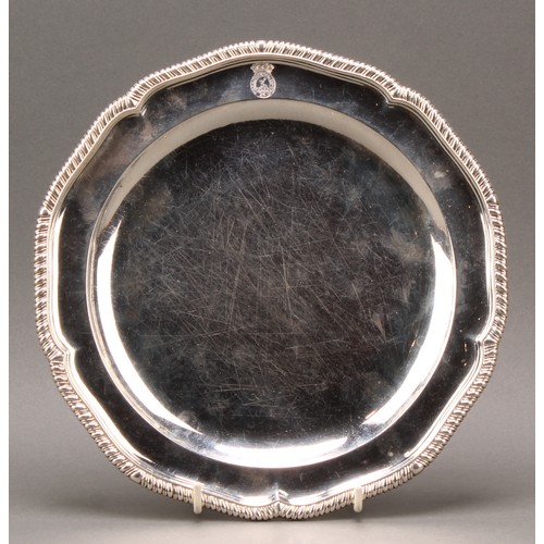 409 - A set of twelve George III silver shaped circular dinner plates, gadrooned borders, 24.5cm diam, som... 