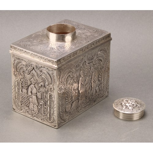 134 - A George III silver rectangular tea caddy, chased overall in the chinoiserie taste with Chinese figu... 