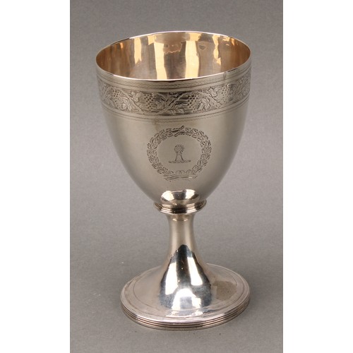 132 - A George III silver pedestal goblet, bright-cut and wriggle-work engraved, reeded spreading circular... 