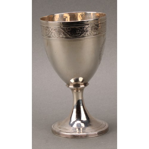 132 - A George III silver pedestal goblet, bright-cut and wriggle-work engraved, reeded spreading circular... 