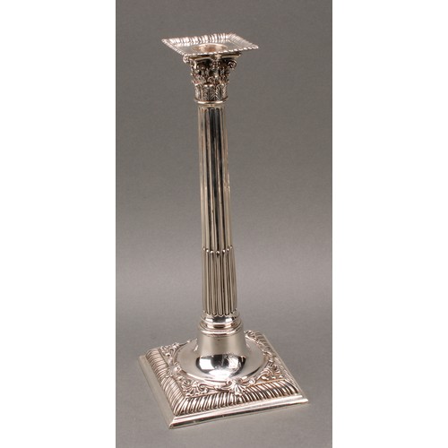 208 - A set of four early George III cast silver Corinthian column table candlesticks, detachable nozzles,... 