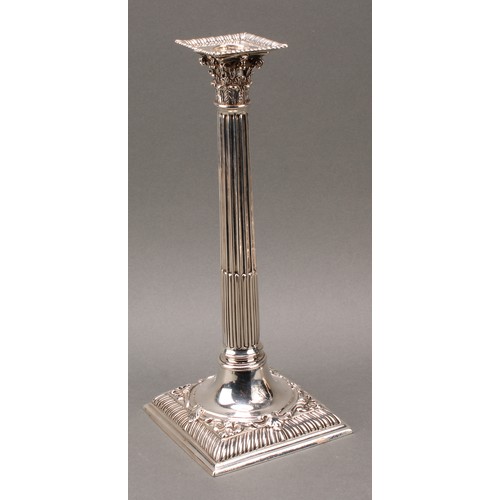 208 - A set of four early George III cast silver Corinthian column table candlesticks, detachable nozzles,... 