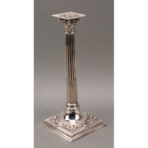 208 - A set of four early George III cast silver Corinthian column table candlesticks, detachable nozzles,... 