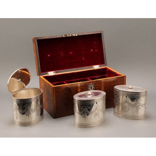 408 - A set of three George III silver oval tea caddies, bright-cut engraved in the Neo-Classical taste wi... 