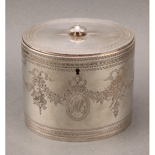 408 - A set of three George III silver oval tea caddies, bright-cut engraved in the Neo-Classical taste wi... 