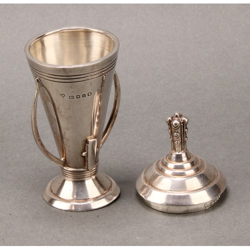 337 - An Art Deco silver rocket shaped cabinet cup and cover, 13cm high, Charles Boyton & Son Ltd, London ... 