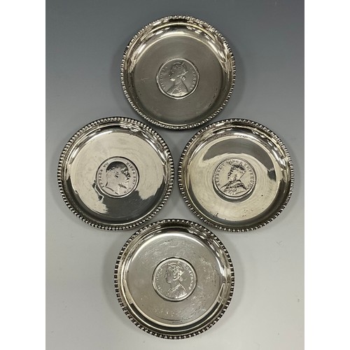 399 - A set of four silver Indian coin pin dishes, each marked one Rupee, dates, 1878, 1888, 1907, 1919, 8... 