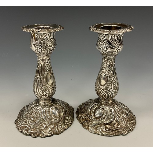 195 - A pair of late Victorian silver candlesticks, weighted bases, Henry Wigfull, Sheffield 1897, 12cm hi... 