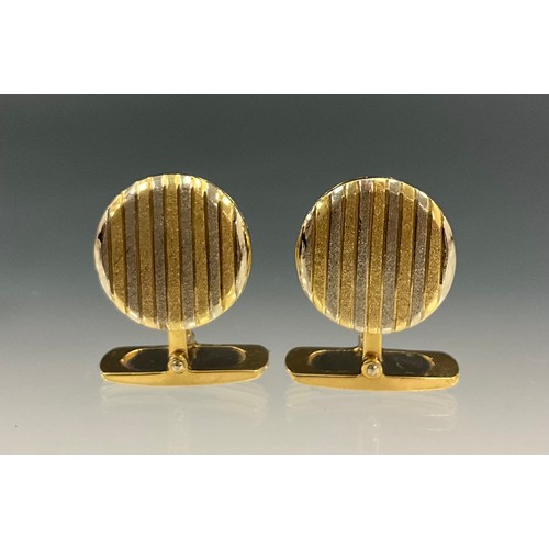 626 - A pair of Italian two tone yellow and white 18ct gold cufflinks, circular stripped hinged top, stamp... 