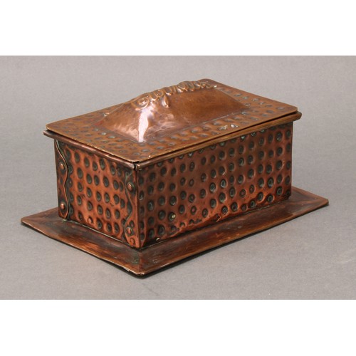 1880 - An Arts and Crafts copper cigarette box, planished overall, hinged sarcophagus cover repousse emboss... 