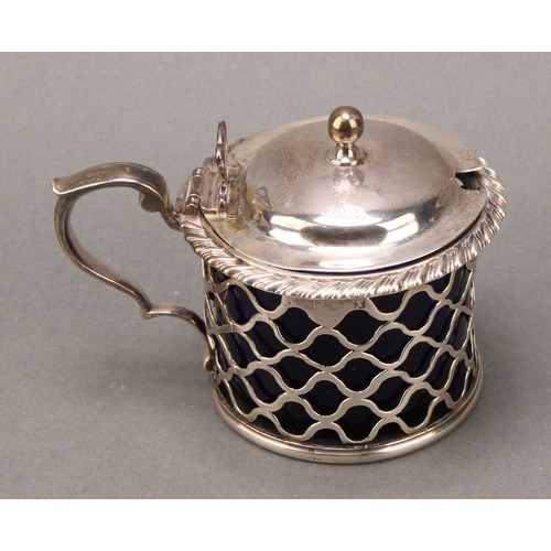 120 - A George III Irish silver mustard, hinged domed cover, with ball finial, gadrooned rim, pierced side... 