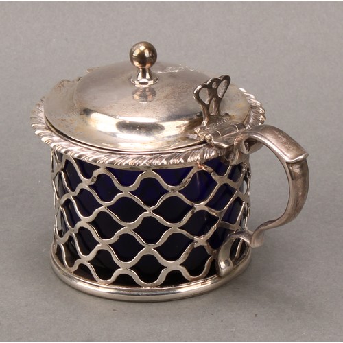 120 - A George III Irish silver mustard, hinged domed cover, with ball finial, gadrooned rim, pierced side... 