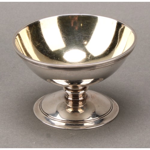 396 - A set of four George III silver circular pedestal salts, reeded borders, gilt interiors, 8.5cm diam,... 