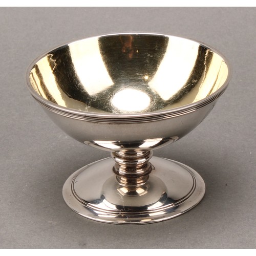 396 - A set of four George III silver circular pedestal salts, reeded borders, gilt interiors, 8.5cm diam,... 