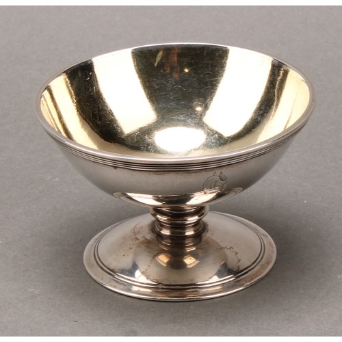 396 - A set of four George III silver circular pedestal salts, reeded borders, gilt interiors, 8.5cm diam,... 