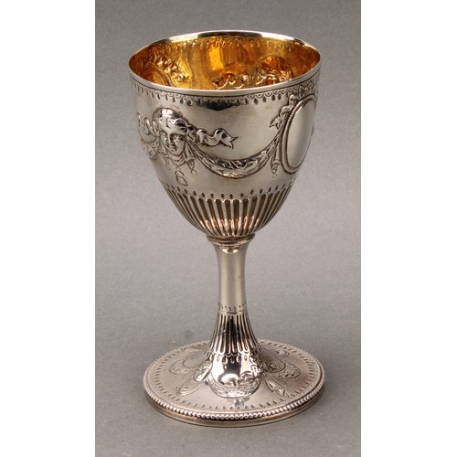 182 - Hester Bateman - a George III silver pedestal goblet, chased in the Neo-Classical taste with ribbon-... 