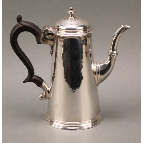 117 - A George II spreading cylindrical coffee pot, hinged cover with knop finial, skirted base, fruitwood... 