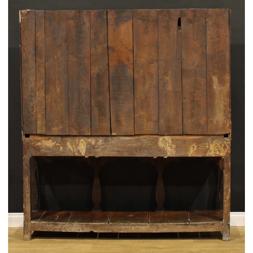 1898 - A George III oak pot board dresser, probably Welsh, the superstructure with two plate rack shelves a... 