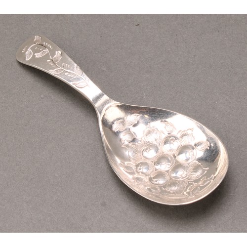 358 - A George III style silver caddy spoon, the bowl chased with fruiting foliage, 9.5cm long, Birmingham... 