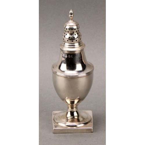 133 - A George III silver pedestal sugar caster, ogee cover with acorn finial, reeded borders, square base... 