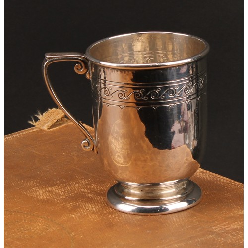 187 - Liberty & Co - an Arts and Crafts silver mug, engraved with a band of stylised Vitruvian scrolls, on... 