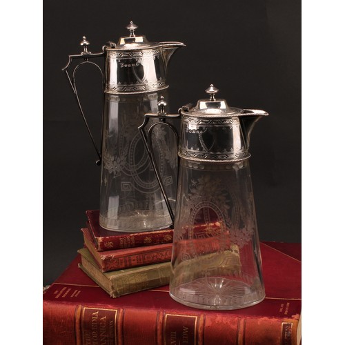 198 - A pair of Victorian silver mounted oval claret jugs, bright-cut engraved and etched in the Neo-Class... 