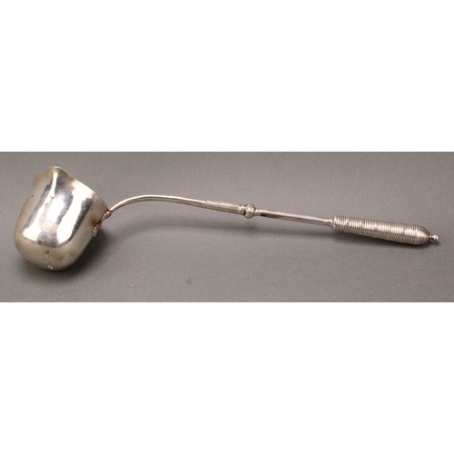 306 - A Continental silver punch ladle, probably German, deep flared bowl with gilt interior, ribbed grip,... 