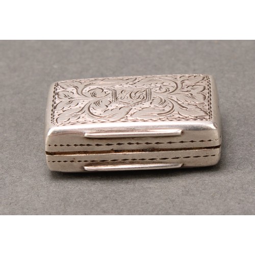 467 - An early Victorian silver rounded rectangular vinaigrette, bright-cut engraved with scrolling leaves... 