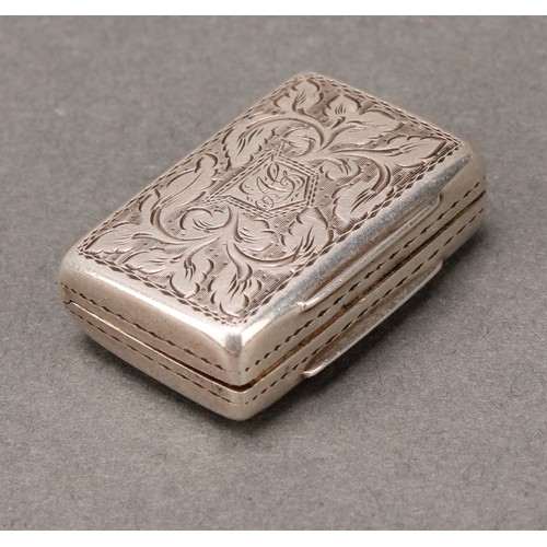 467 - An early Victorian silver rounded rectangular vinaigrette, bright-cut engraved with scrolling leaves... 