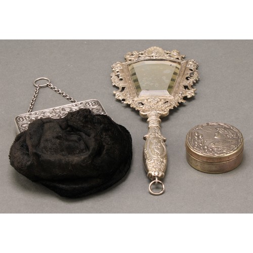 304 - A Continental silver coloured metal hand mirror, cast with a peacock, putti, flowers and scrolls, 20... 