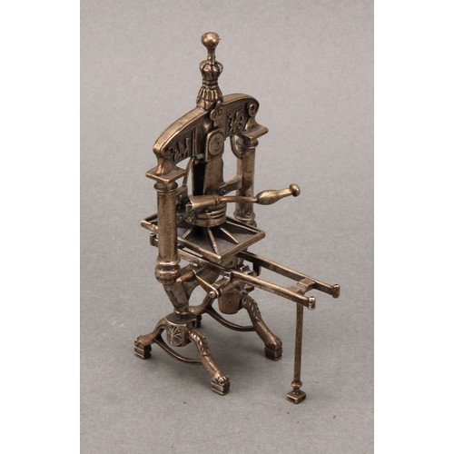 231 - Silver Toys and Miniatures - a Continental silver novelty model of a printing press, 11.5cm high, ma... 