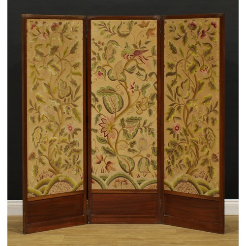 2141 - An Arts & Crafts period mahogany and woolwork three fold screen, worked in coloured threads with bir... 