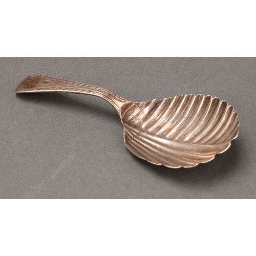 62 - A George III silver caddy spoon, fluted bowl, 10cm long, Solomon Hougham, London 1807; etc (4), 40g