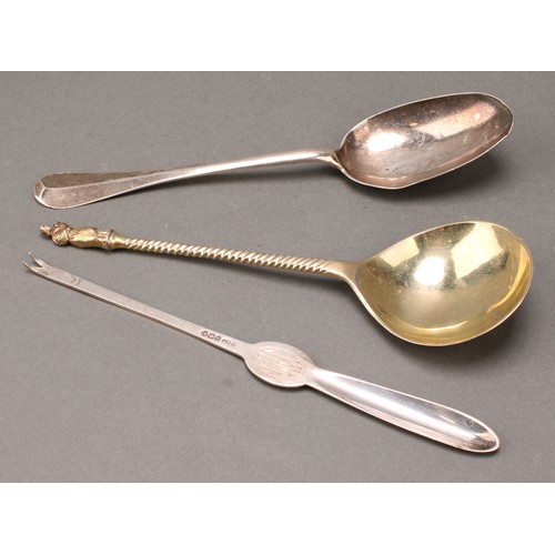 261 - A George I silver Hanoverian pattern table spoon, 19.5cm long, London 1720; a Continental silver-gil... 