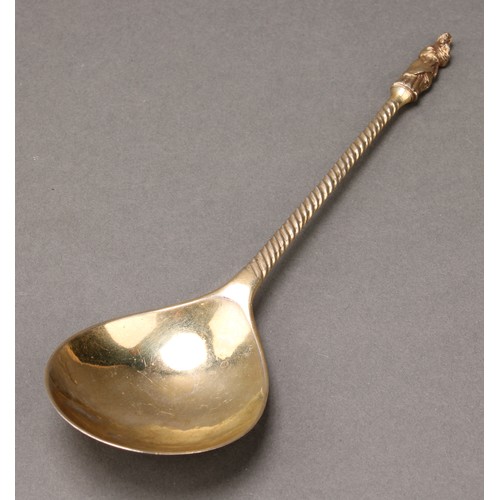 261 - A George I silver Hanoverian pattern table spoon, 19.5cm long, London 1720; a Continental silver-gil... 