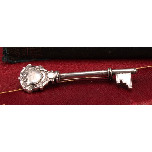 176 - Copoclephily - a George V silver presentation key, 10cm long, Birmingham 1923, mounted as a brooch, ... 