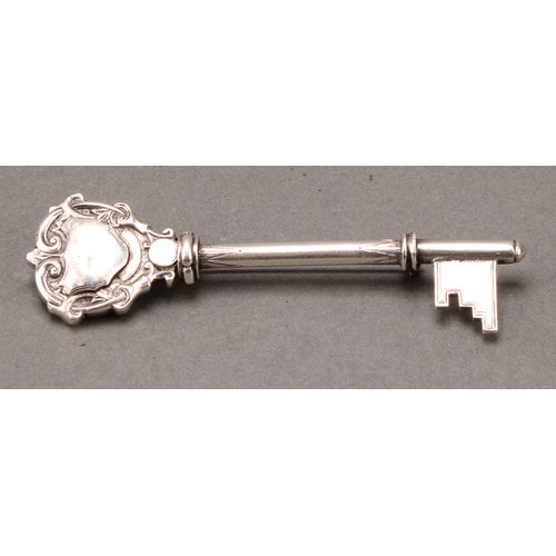 176 - Copoclephily - a George V silver presentation key, 10cm long, Birmingham 1923, mounted as a brooch, ... 