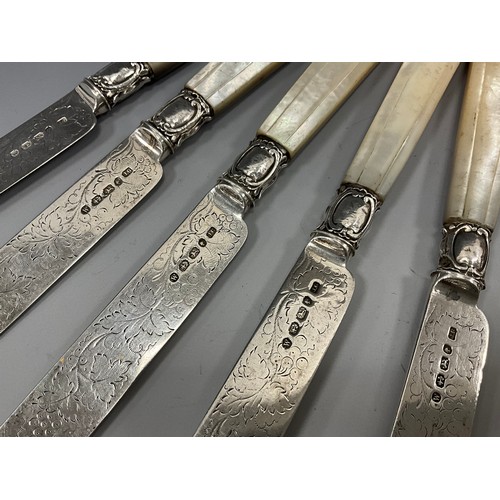 403 - A set of six Victorian silver mother of pearl handled dessert knives and forks, grape vine blades an... 