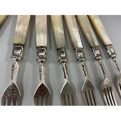 403 - A set of six Victorian silver mother of pearl handled dessert knives and forks, grape vine blades an... 