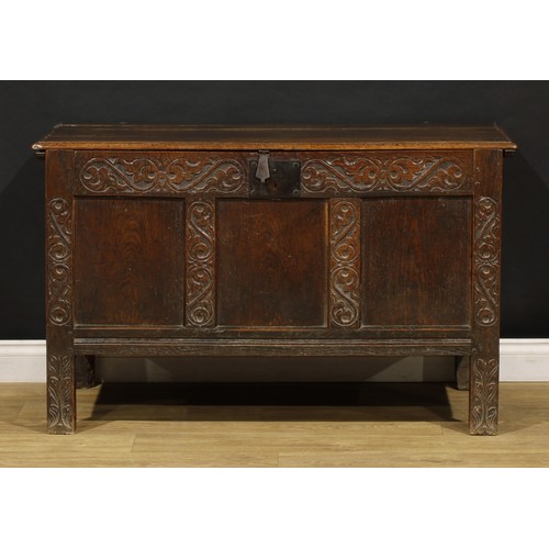 1681 - A Charles II oak blanket chest, hinged top above a carved three panel front, stile feet, 75cm high, ... 