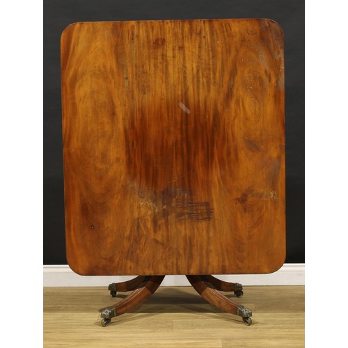 1595 - A 19th century mahogany breakfast table, rounded rectangular top with channelled edge, turned column... 