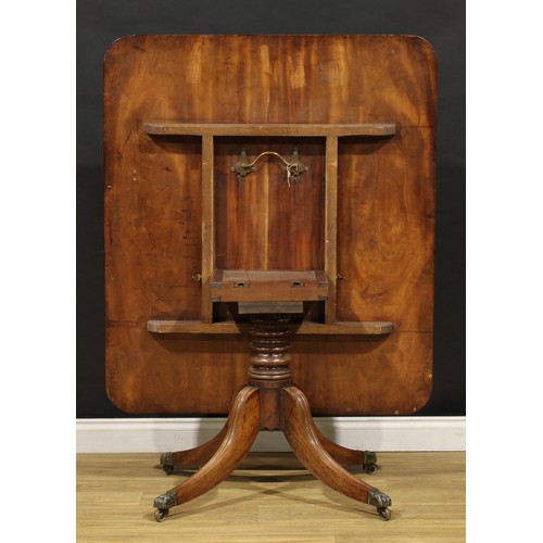 1595 - A 19th century mahogany breakfast table, rounded rectangular top with channelled edge, turned column... 