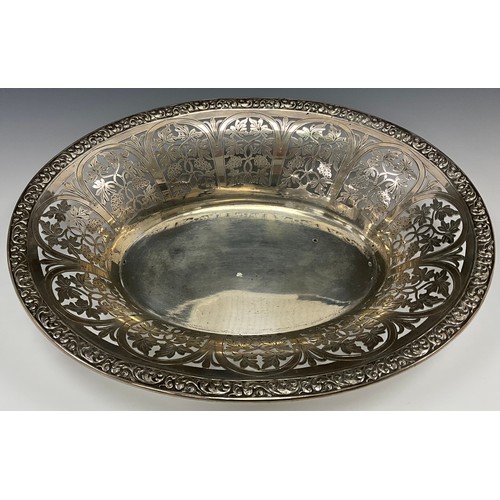 456 - An Austrian oval bread dish, decorated with a pierced border of grapevines, Austria, c.1925, 28cm wi... 