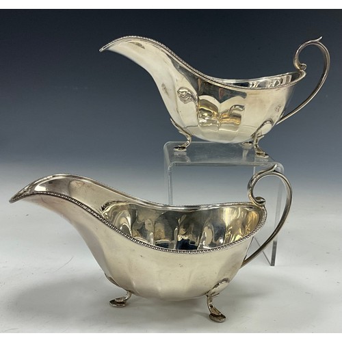 381 - A pair of Elizabeth II silver sauce boats, beaded lip, scrolling handles, Manoah Rhodes & Sons Ltd, ... 