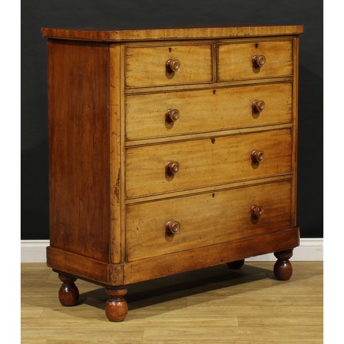 1785 - A Victorian mahogany chest, of two short and three long graduated cockbeaded drawers, turned handles... 