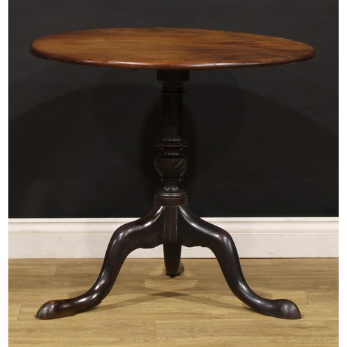 1773 - A George III mahogany tripod occasional table, one-piece circular tilting top, turned and wrythen fl... 