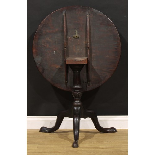 1773 - A George III mahogany tripod occasional table, one-piece circular tilting top, turned and wrythen fl... 