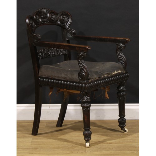 1530 - A 19th century Anglo-Indian padouk bar-back desk chair, carved throughout with floral and foliate mo... 